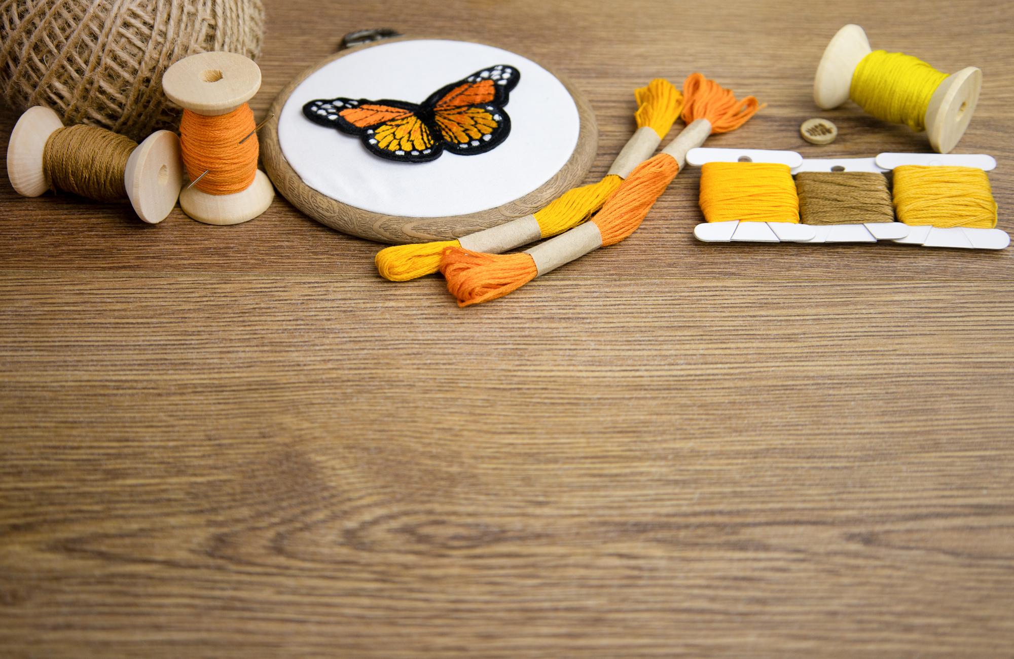atelier interior with wooden table and embroidery tools